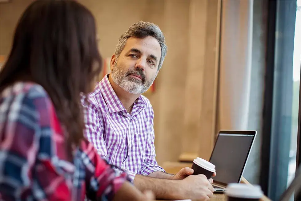 Irish business owners discussing solar investment and Accelerated Capital Allowance tax relief